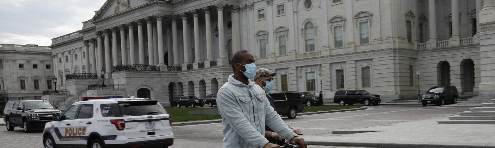 Two men ride electric scooters on Capitol Hill in Washington D.C., March 20, 2020. Photo by Gripas Yuri/ABACA via Reuters