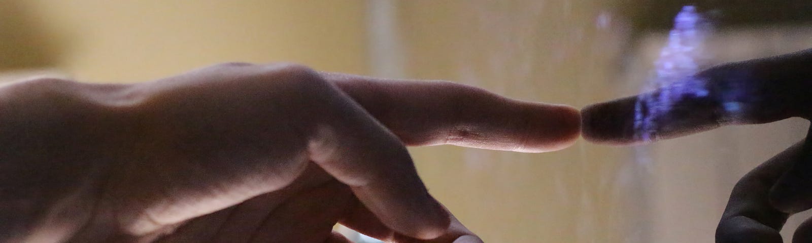 Finger touching glass