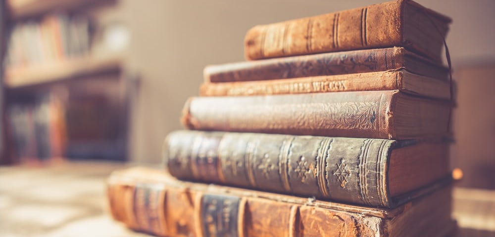 A stack of vintage books.