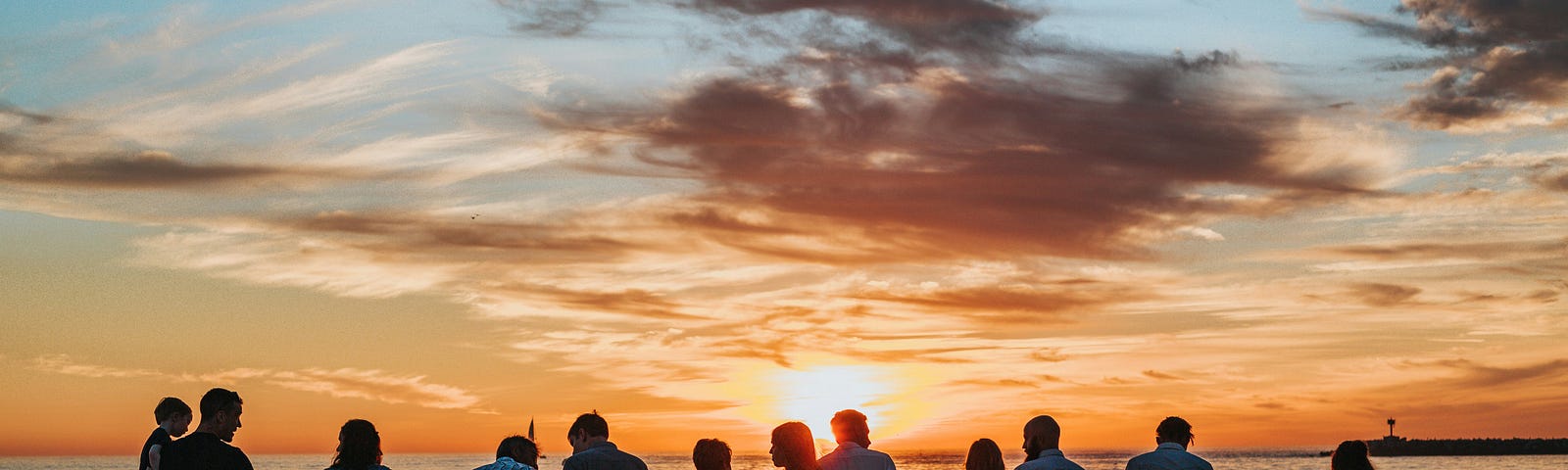 A large family watching the sunset
