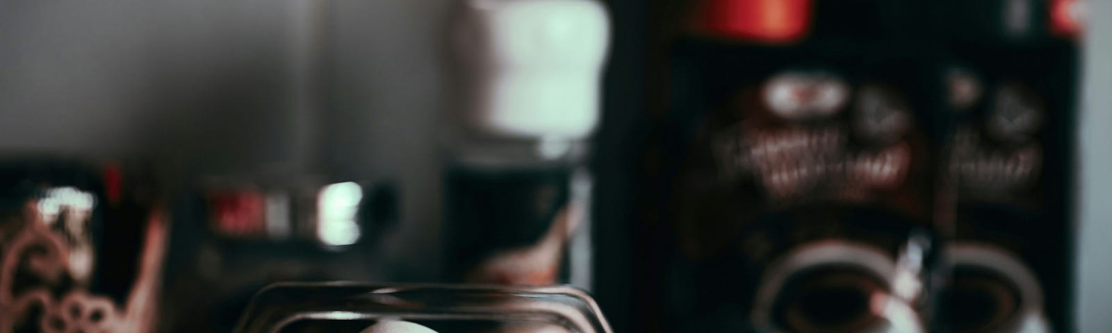 A white egg sits in a clear plastic tray. It has a face of frustration painted on it.