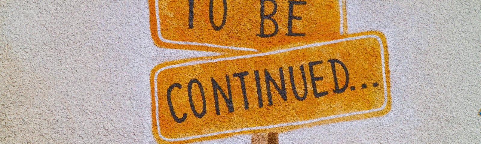 A sign reading “to be continued”