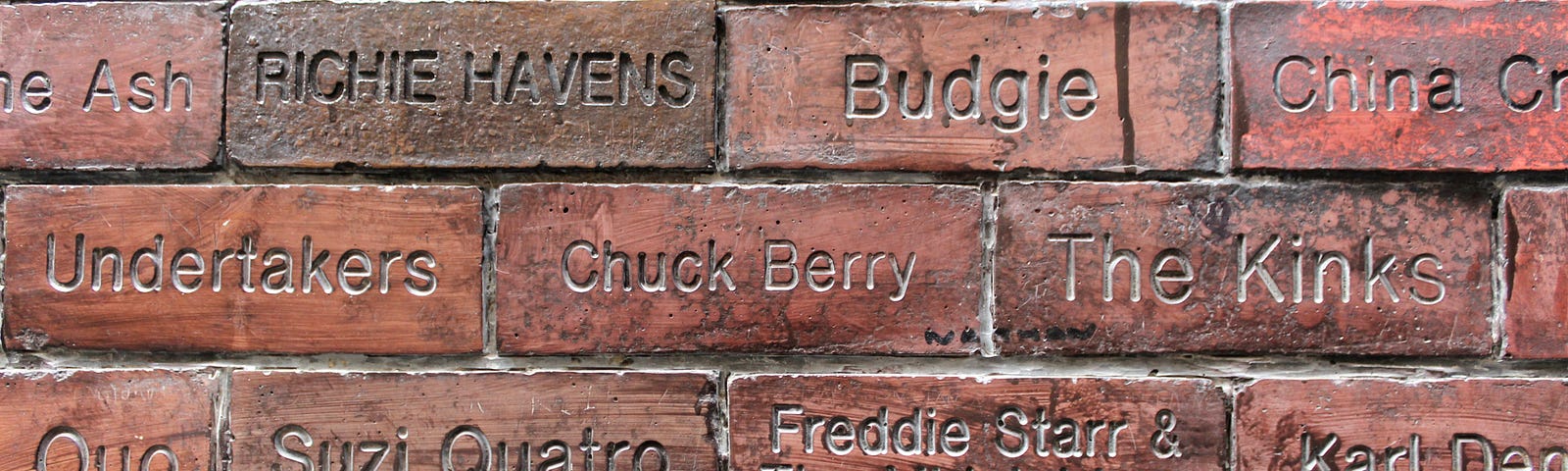 Bricks from the Cavern Club wall featuring names of past performers