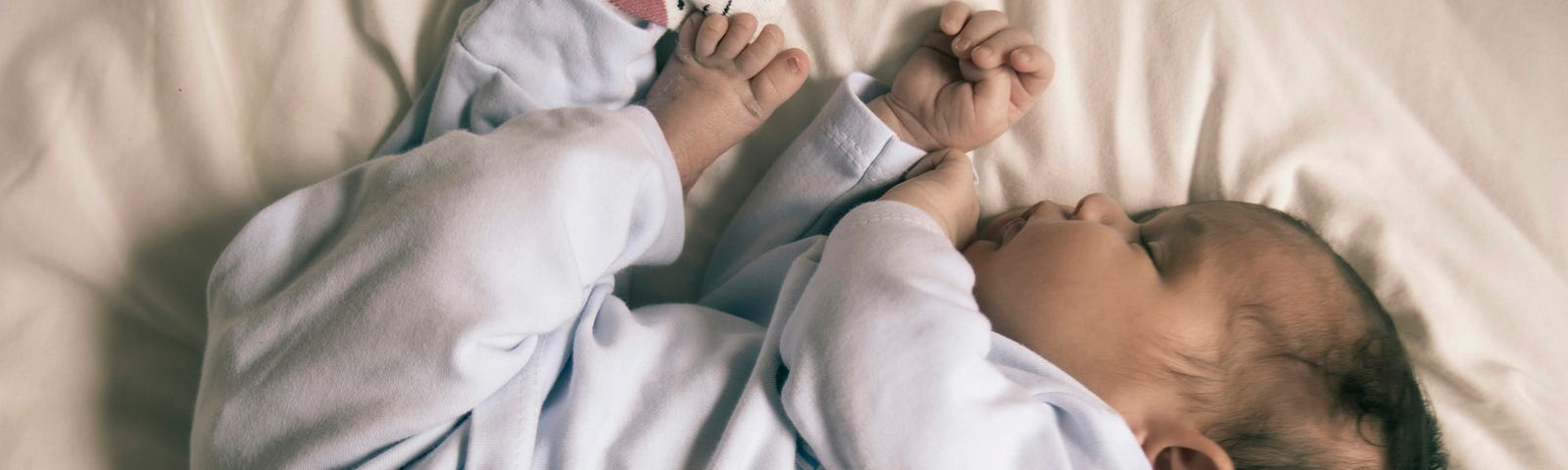 Photo of a baby sleeping like a baby