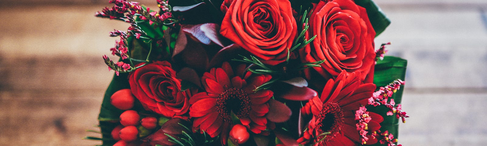 bouquet of red flowers on table