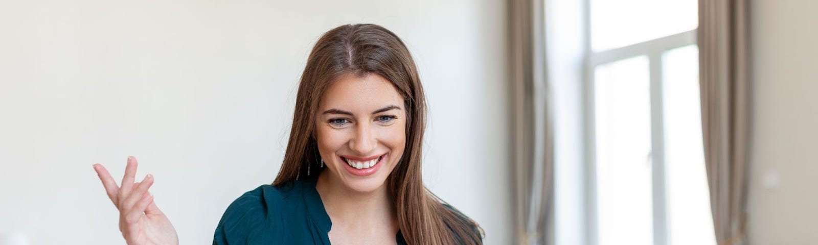 girl looking and smiling at the computer