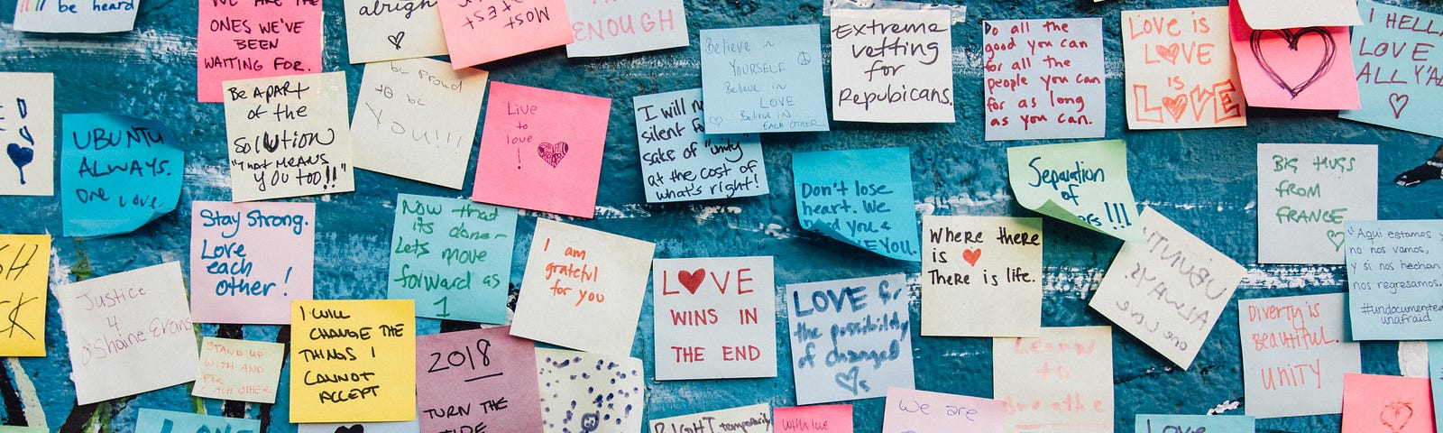 A wall full of post-it love notes.