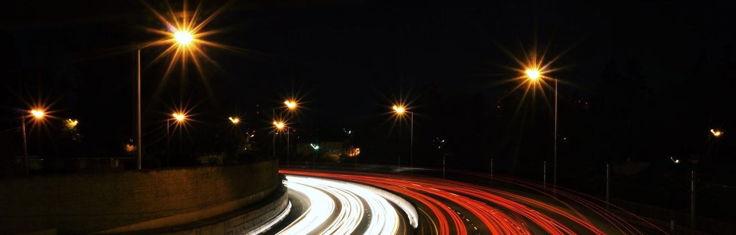red and white lights on a highway