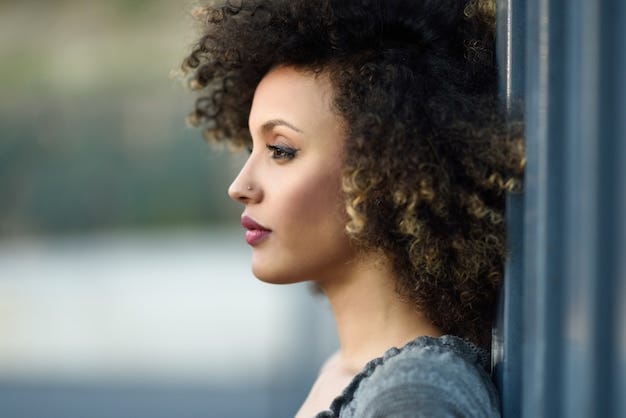 Beautiful young woman with curly brown hair