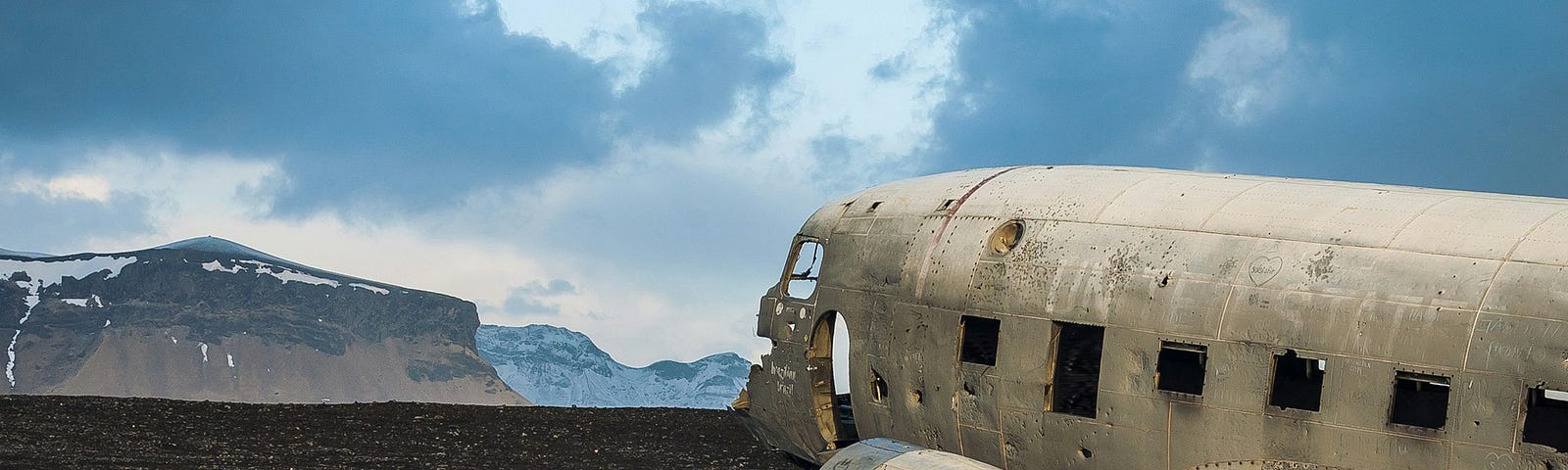 Carcasses of two old planes in a barren landscape