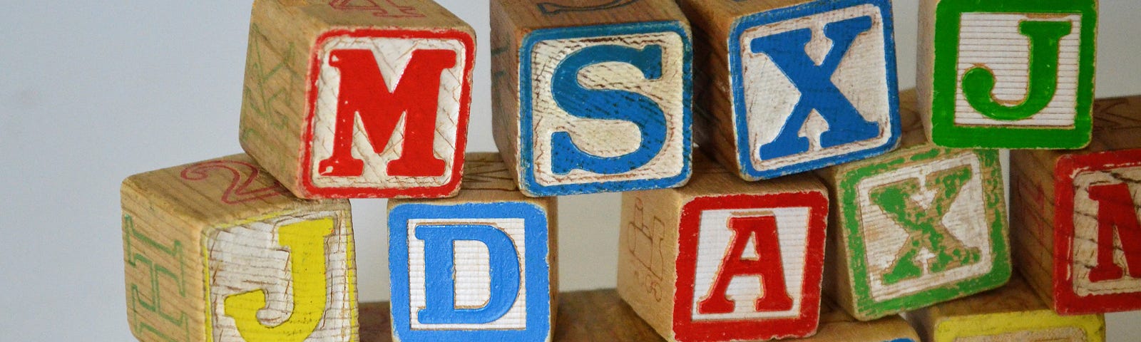 stacks of old Fisher-Price alphabet blocks