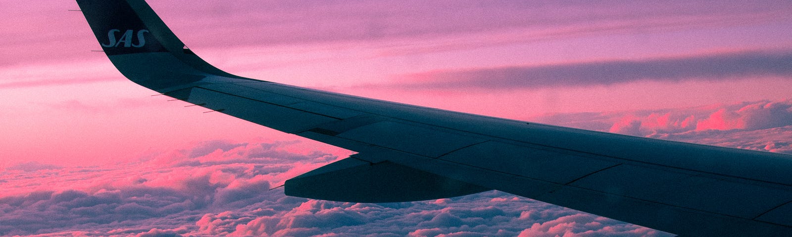 Airplane wing and sunset