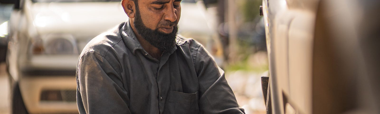 A man changing a tire. Four life skills that everyone should know. Practice before you need it.