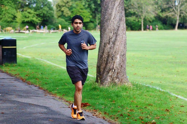 Me Running 5K run in London on a beautiful Saturday morning. I love these Orange Asics shoes and beautiful green Harrow Park