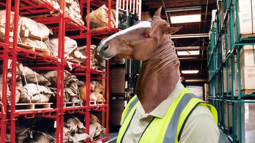 A horse-headed “reverse-centaur” whose eye has been replaced by the glowing eye of HAL9000 from 2001: A Space Odyssey. They are wearing a hi-viz vest and posed in shelving-aisles of an industrial warehouse.