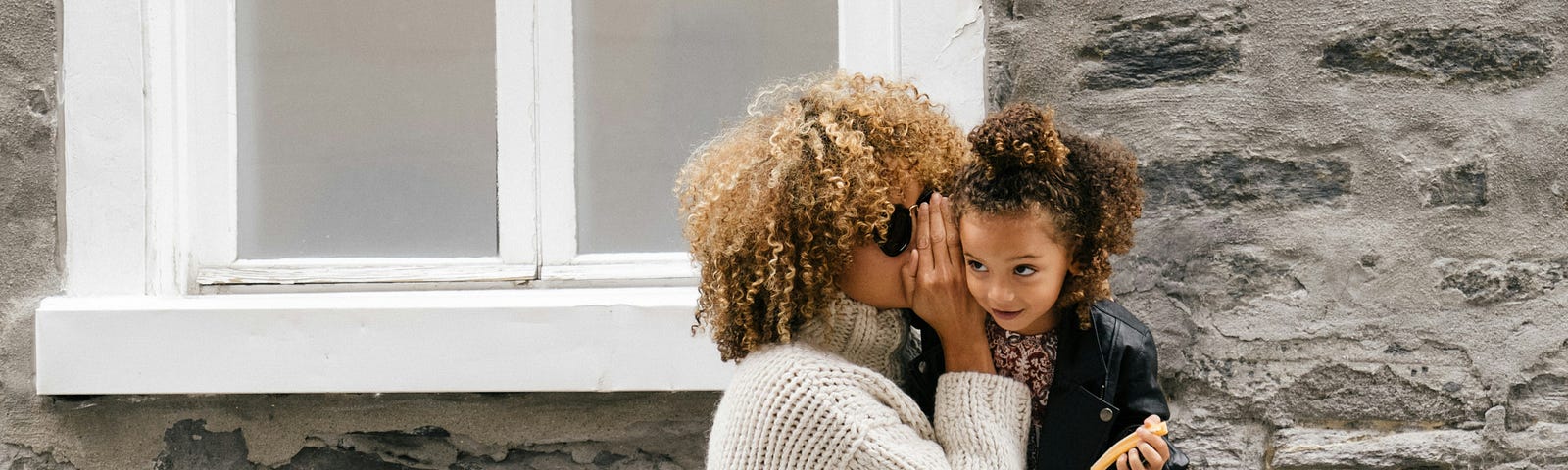 Woman telling a secret to a child (mistakes you shouldn’t make on medium in 2024).