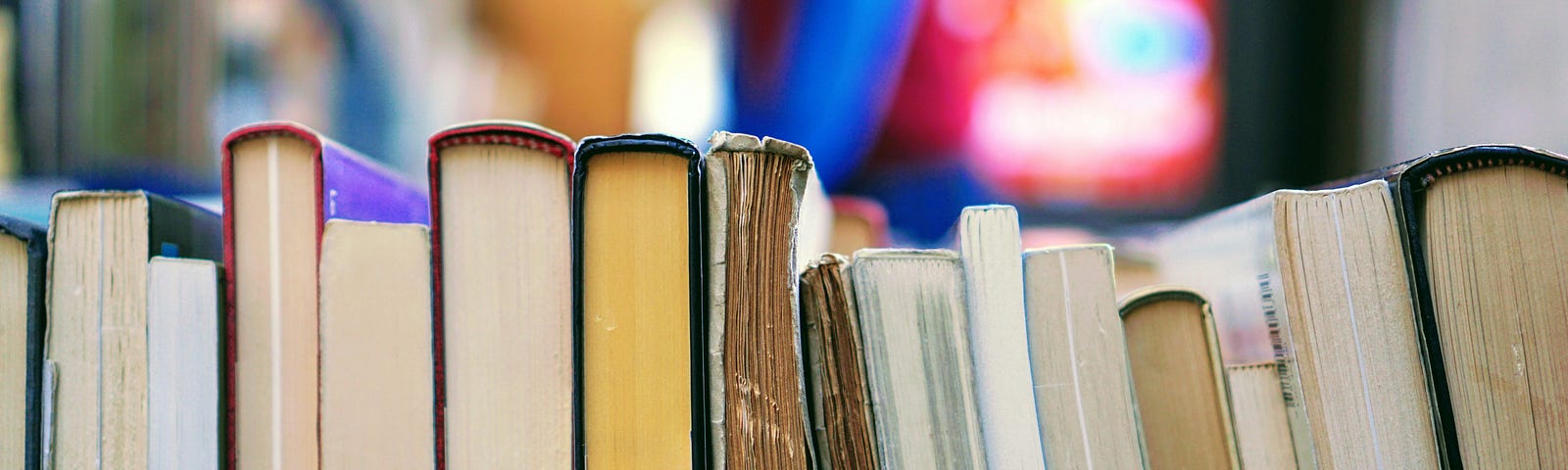 row of books on a shelf, intended to represent hoarding books