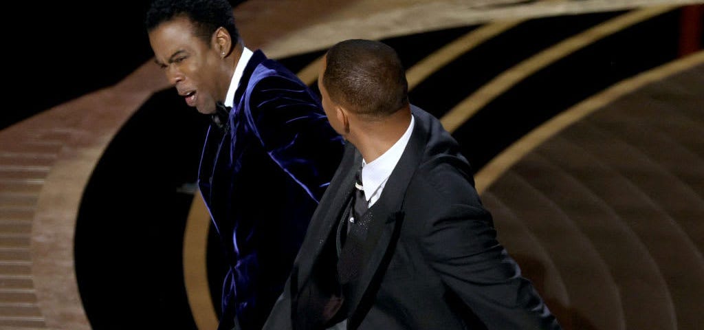 Will Smith slapping Chris Rock across the face at the Academy awards 2022