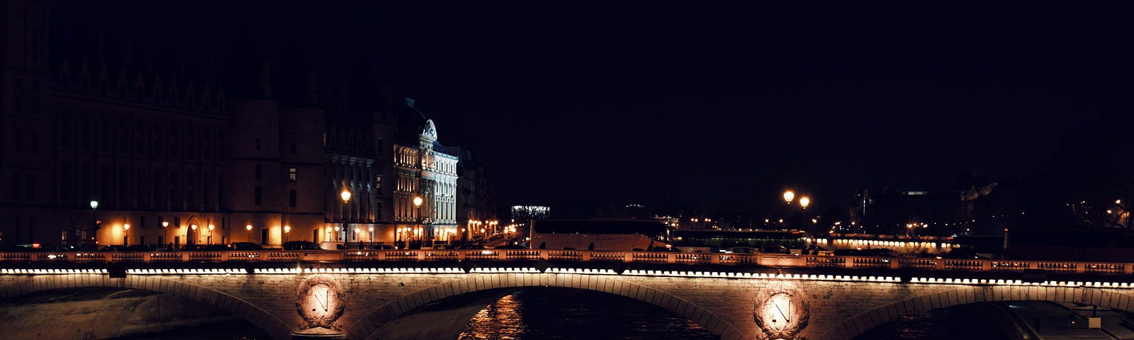 Night scene of a bridge above The Seine.