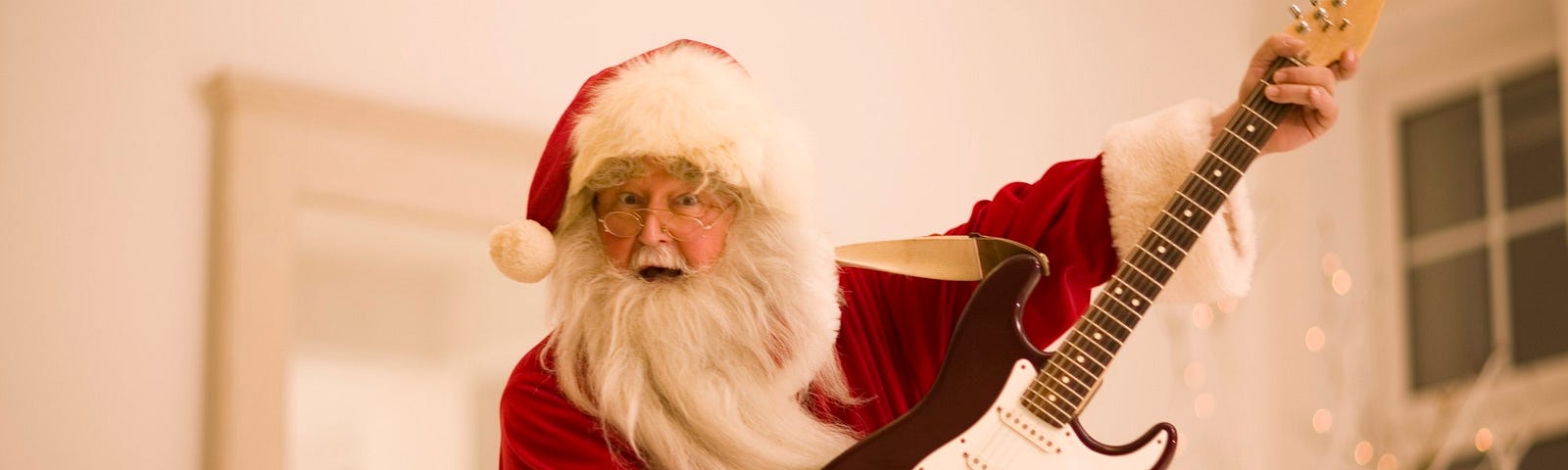 Santa playing an electric guitar