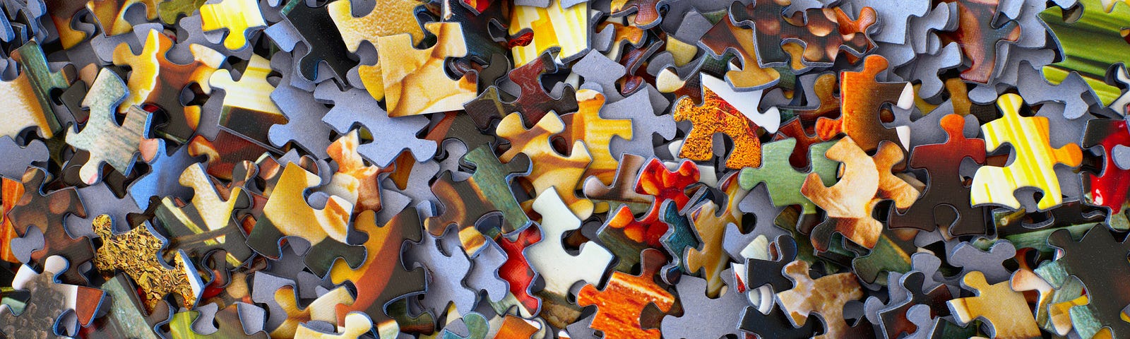 jigsaw puzzles in a big messy pile