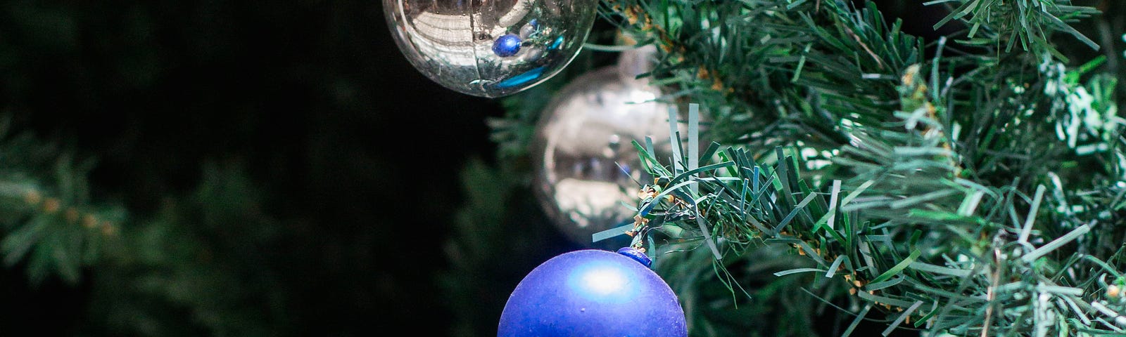 Christmas tree with blue and silver baubles.