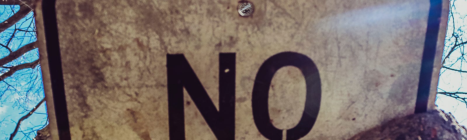 A metal sign that read the word “no”
