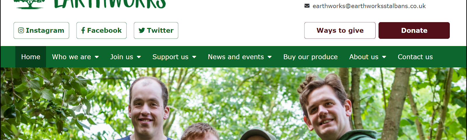 A screenshot of the new Earthworks homepage. It has 4 white male Earthworkers smiling at the camera against a backdrop of green-leafed trees. Above them the logo says ‘Earthworks’ and there are menu items to lots of different places on the website. In the foreground a banner says ‘Welcome to Earthworks’