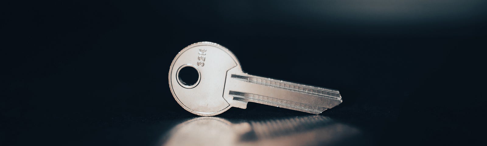 Key on a black surface