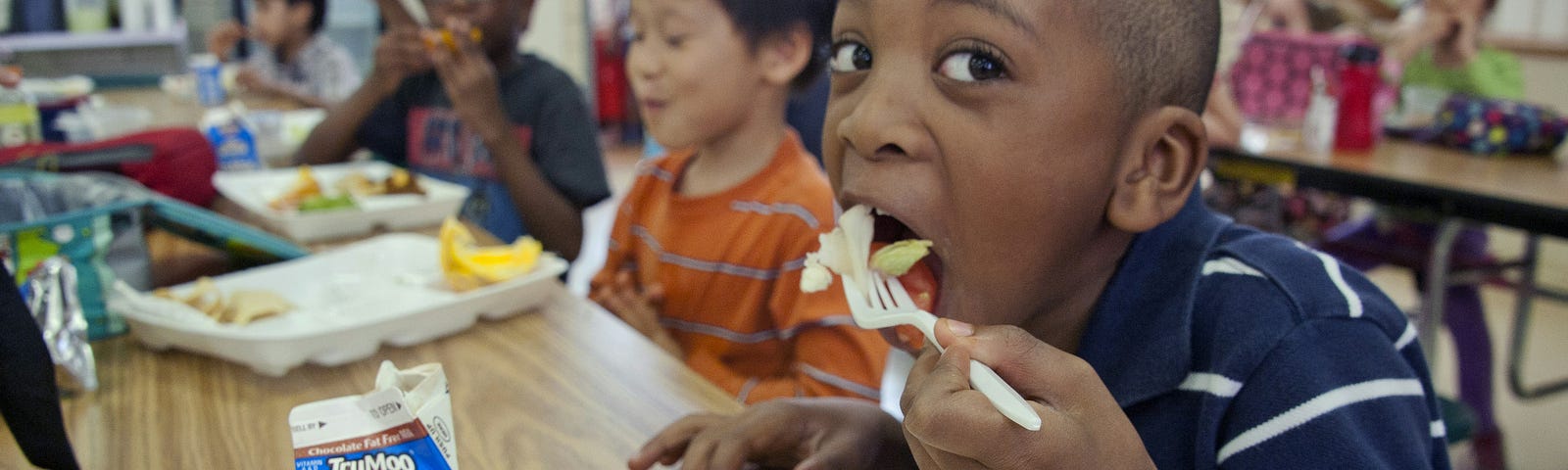 Kids eating at nice tables.