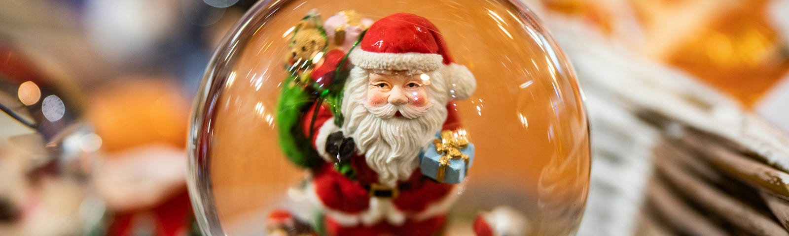 Porcelain Santa inside a snow globe.