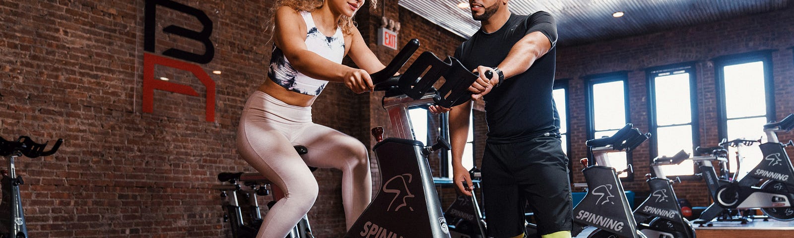 Confident person initiating a friendly conversation at the gym