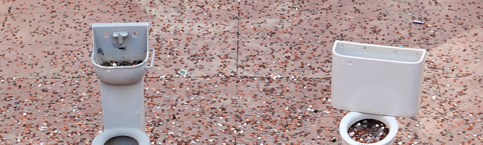 Miniature toilets full of coins