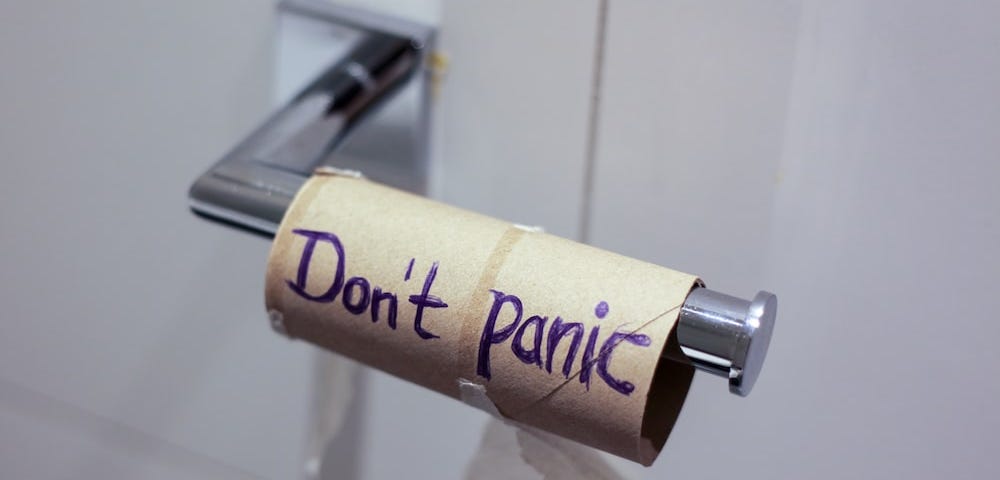 Image of a toilet roll saying Don’t panic. This is so you can be awesomely productive on the toilet.