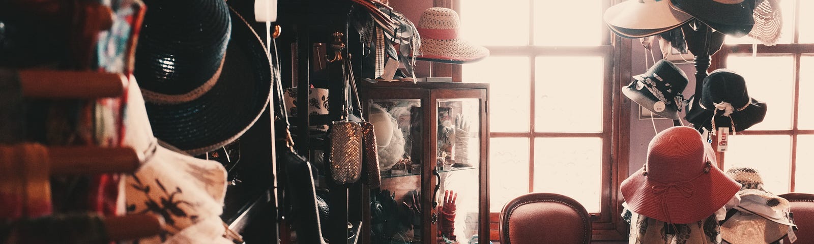 A room filled with clutter and stacked with clothes, hats and books. A representation of the things that your kids don’t want to inherit.