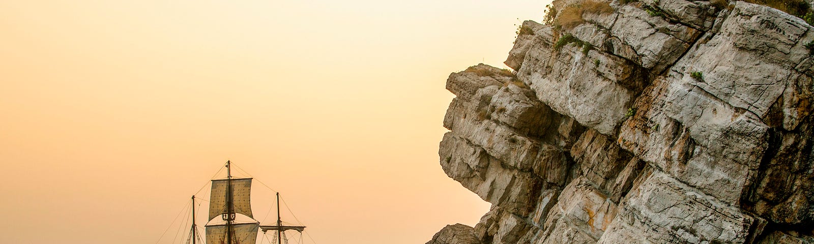 A sailing ship near a coast