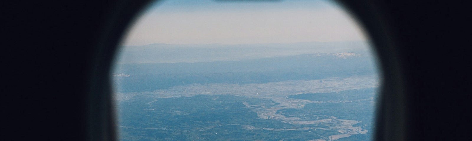 A view of a coastline from an airplane window