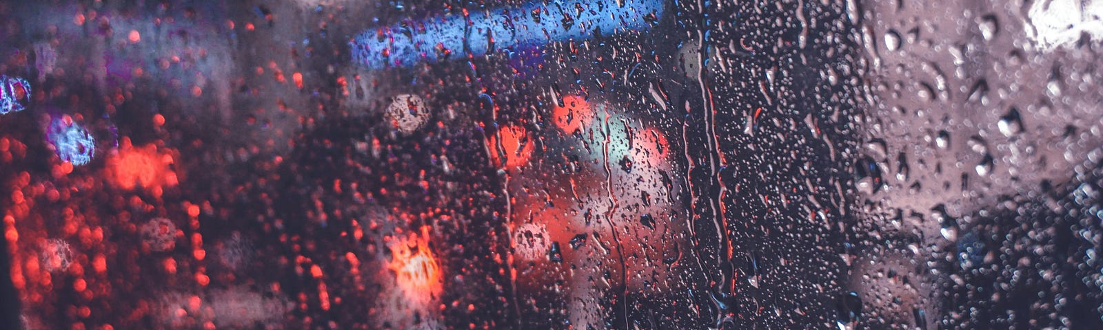 looking out at the rain from inside a car window