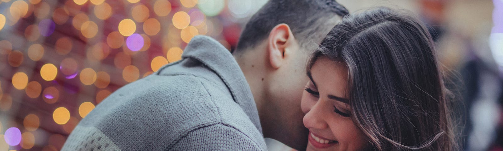 A man giving a kiss to a lady