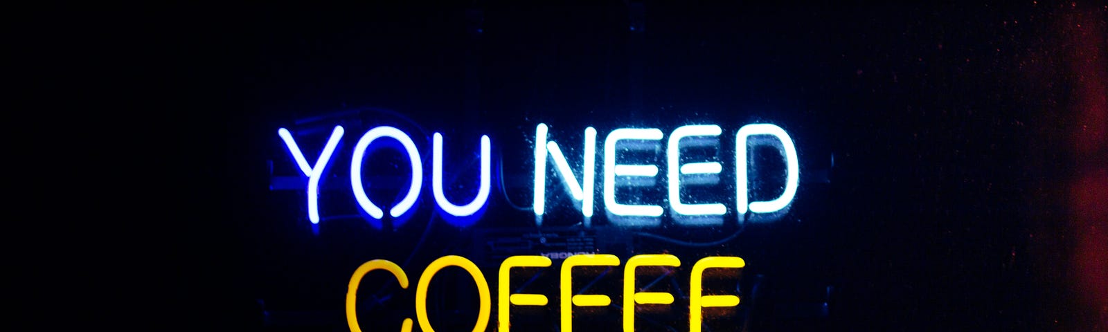 A neon sign that says: You need coffee