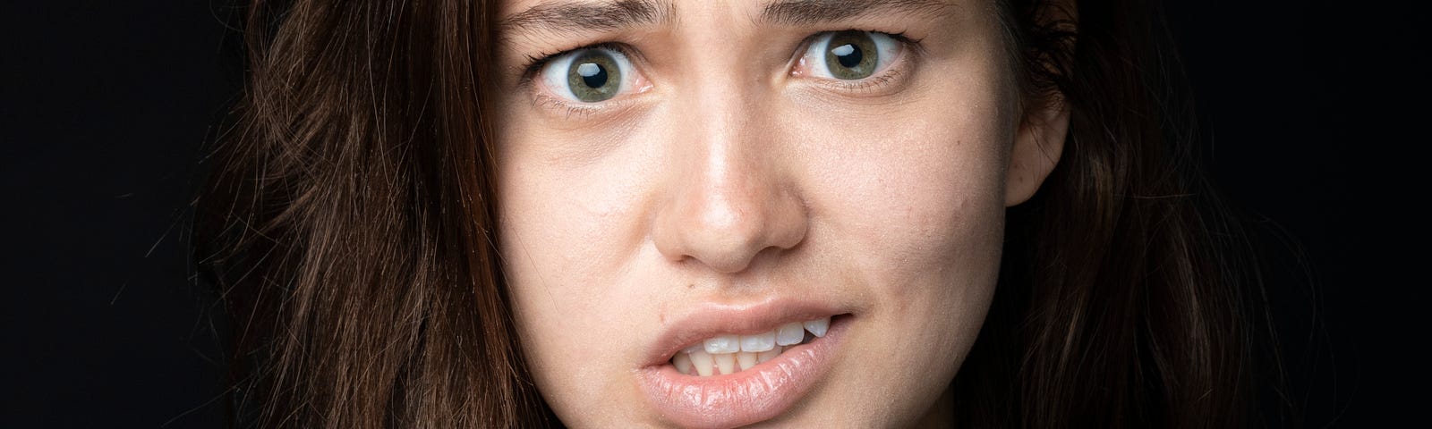 Woman’s face; she is unsure.