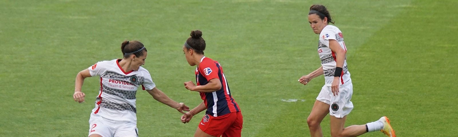 Women playing soccer.