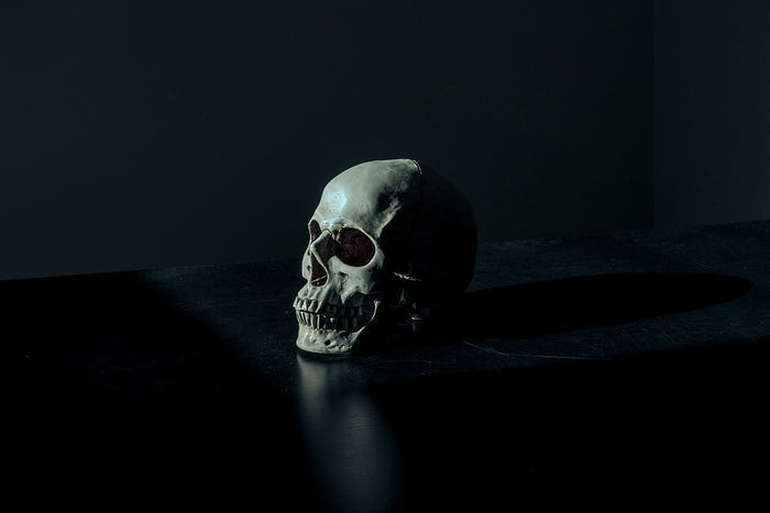 A human skull in a dark room