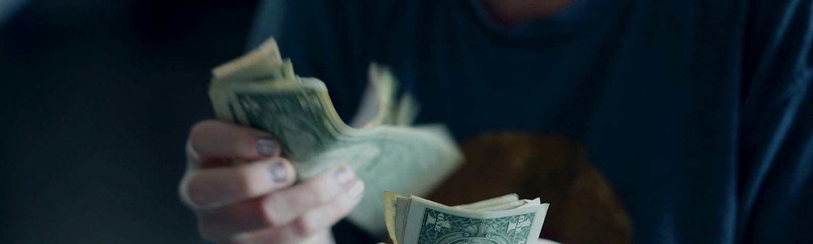 A woman counting money.