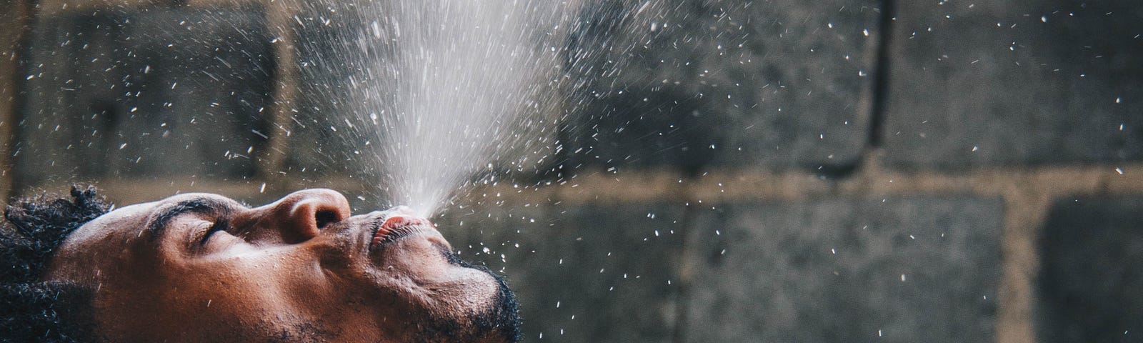 Swish and Spit the Coronavirus With Your Mouthwash. In photo, guy swishing