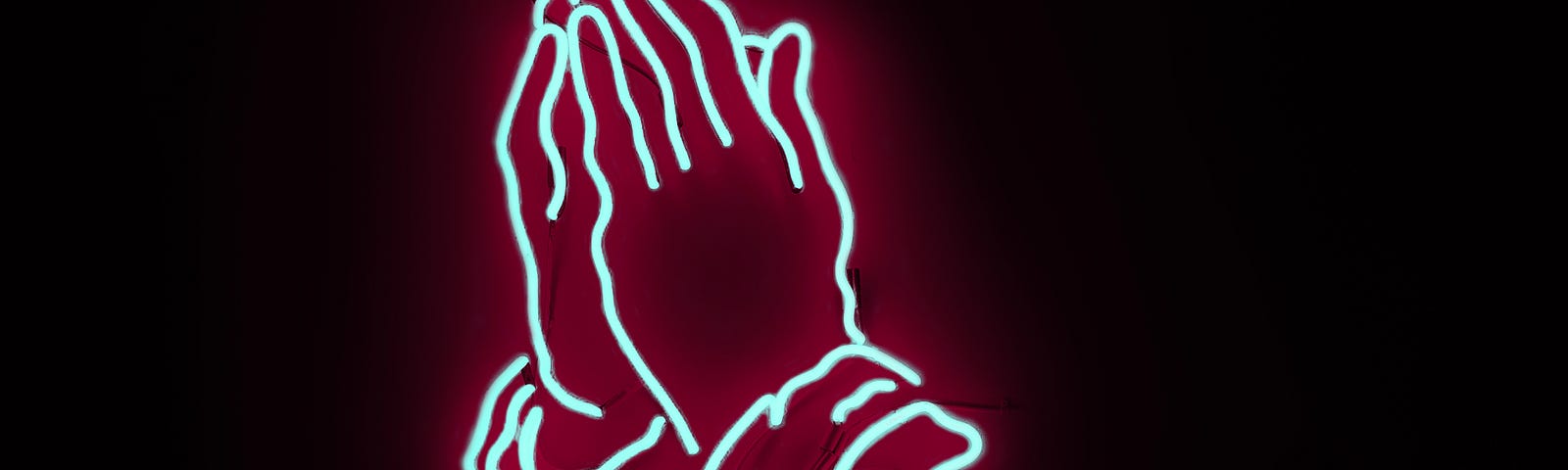 a neon sign in the shape of praying hands