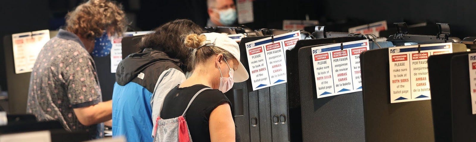 Voters fill out their ballots in Miami, Florida.