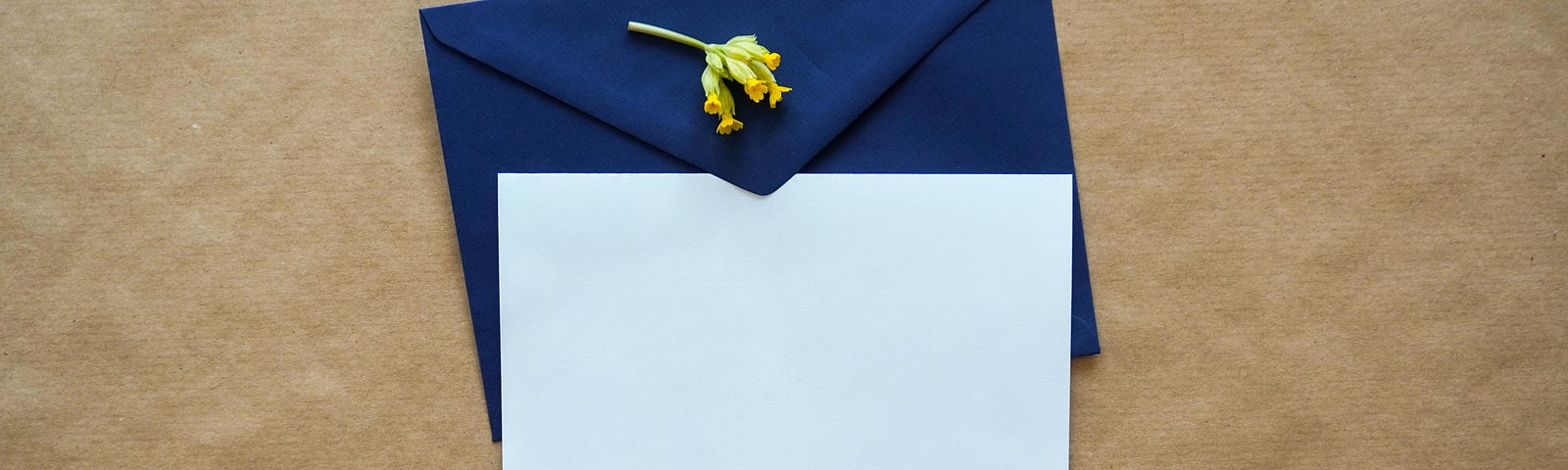 A letter beside a blue envelope