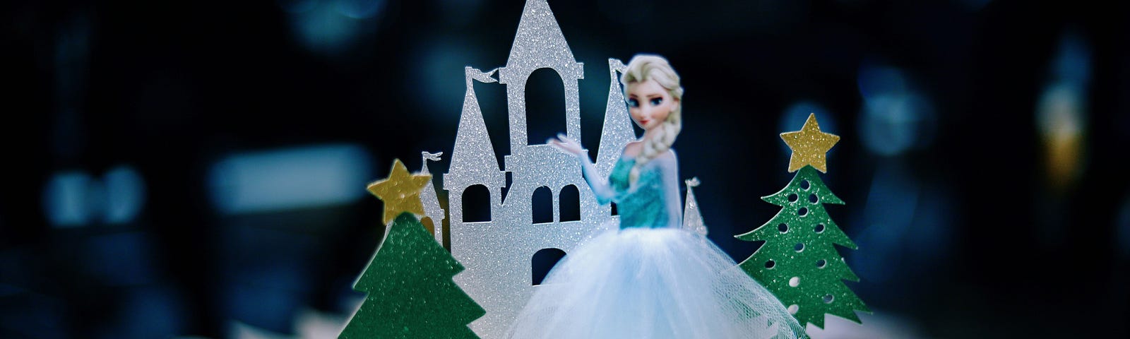 Elsa, princess doll, in front of toy castle