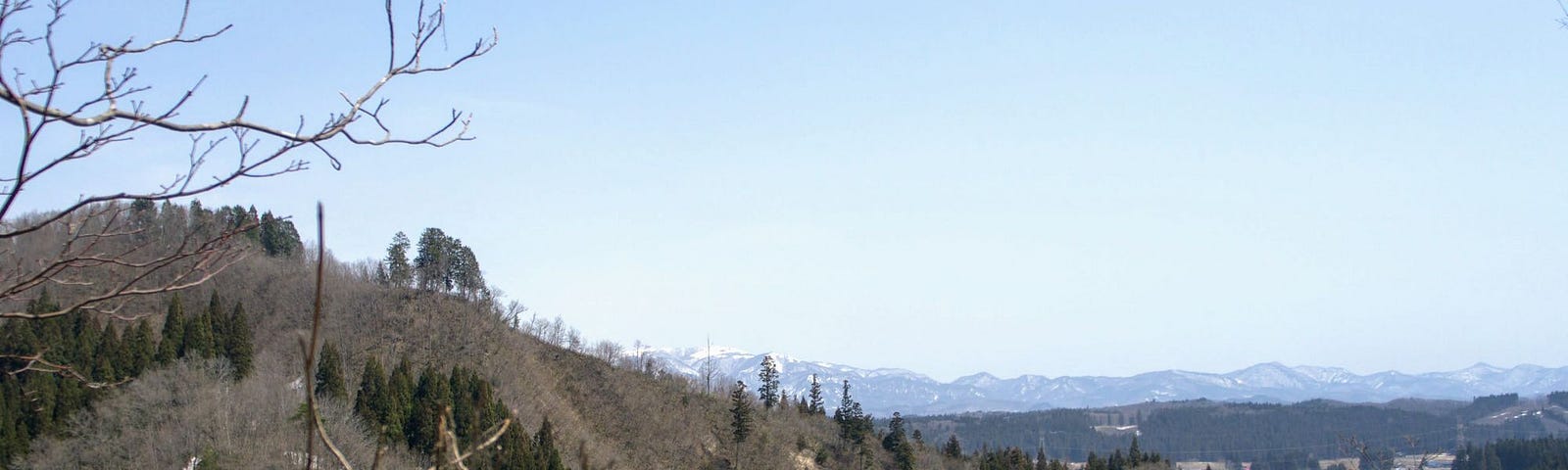 Tiny peak that was home to a medieval castle along the banks of the mighty Mogami River.